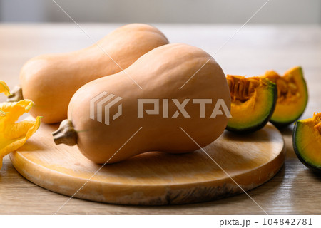Butternut squash and pumpkin on cutting wooden board, Organic vegetable in Autumn season 104842781