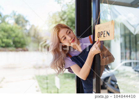 Asian cafe owner or barista standing with smiling at cafe. woman small business owner in food and beverage 104844410
