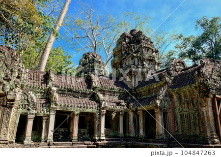 Photo of the crumbling ruins of the famous Khmer temple of Ta Prohm, a prominent tourist attraction in Cambodia. Photo of the crumbling ruins of the famous Khmer temple of Ta Prohm, a prominent tourist attraction in Cambodia. 104847263