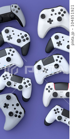 Set of lying gamer joysticks or gamepads on purple background 104851921