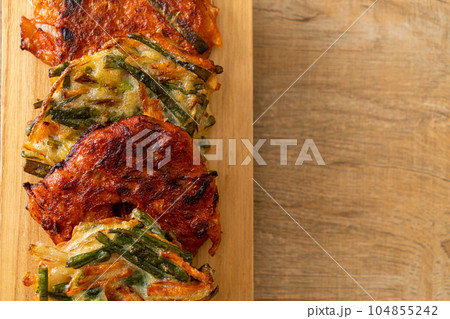 Pajeon or Korean pancake and Korean Kimchi pancake or Kimchijeon on white background Pajeon or Korean pancake and Korean Kimchi pancake or Kimchijeon on white background 104855242