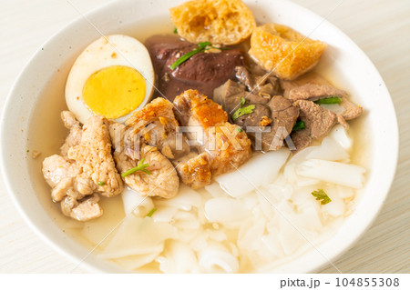 paste of rice flour or boiled Chinese pasta square in clear soup paste of rice flour or boiled Chinese pasta square in clear soup 104855308