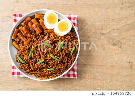 Jjajang Rabokki - Korean instant noodles or Ramyeon with Korean rice cake or Tteokbokki and egg in black bean sauce Jjajang Rabokki - Korean instant noodles or Ramyeon with Korean rice cake or Tteokbokki and egg in black bean sauce 104855726