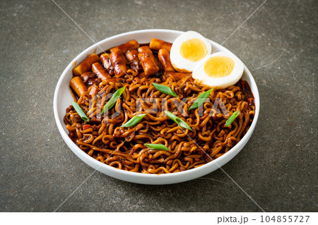 Jjajang Rabokki - Korean instant noodles or Ramyeon with Korean rice cake or Tteokbokki and egg in black bean sauce Jjajang Rabokki - Korean instant noodles or Ramyeon with Korean rice cake or Tteokbokki and egg in black bean sauce 104855727