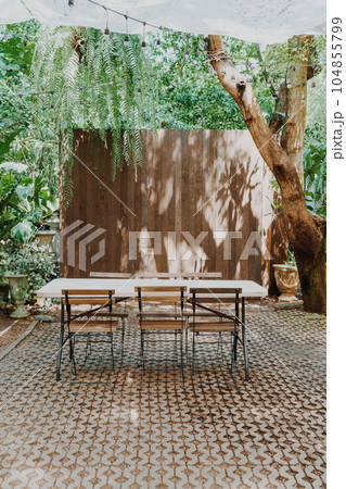 empty wood chair and table in garden 104855799