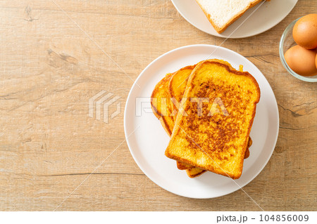 french toast on white plate 104856009
