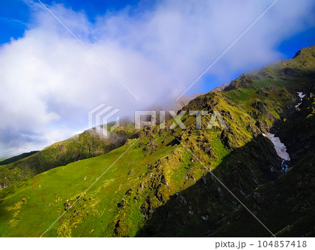 Beautiful mountain landscape with clouds in the sky Beautiful mountain landscape with clouds in the sky 104857418