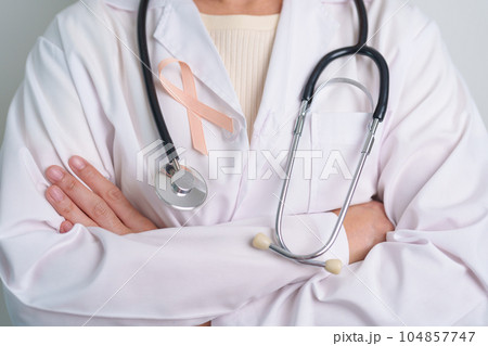 Peach Ribbon for September Uterine Cancer Awareness month. Healthcare and World cancer day concept 104857747