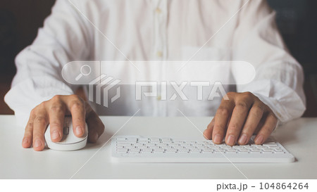 Man using a computer keyboard to Searching for information on internet. Man using a computer keyboard to Searching for information on internet. 104864264