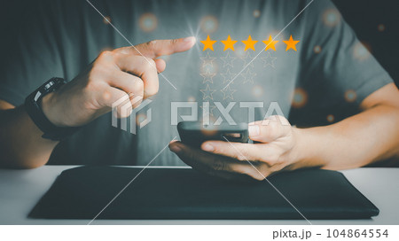 Customer Experience Concept, Best Excellent Services Rating for Satisfaction present by Hand of Client pressing Five Star. Customer Experience Concept, Best Excellent Services Rating for Satisfaction present by Hand of Client pressing Five Star. 104864554