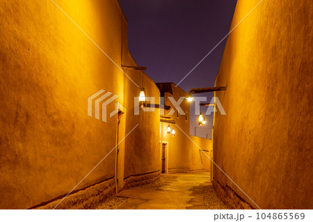 Diriyah old town traditional street illuminated at night, Riyadh, Saudi Arabia 104865569