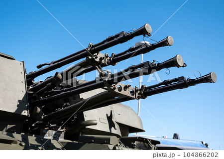 Heavy machine gun on a military vehicle, modern military equipment 104866202