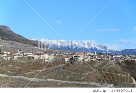 alpine village and landscape at Dolomites alps, Italy 104867011