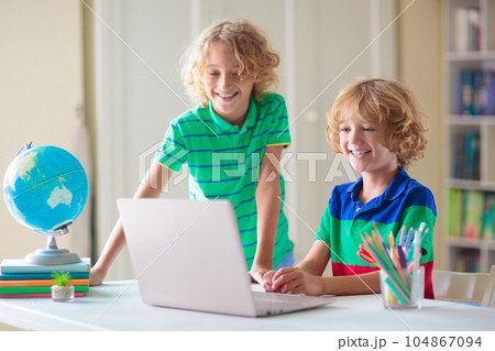 Online remote learning. School kids with computer. 104867094
