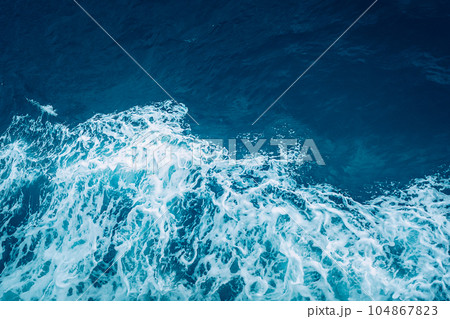 View from above turquoise ocean waves background. 104867823