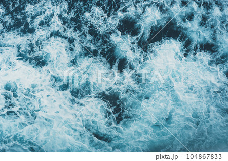 View from above turquoise ocean waves background. View from above turquoise ocean waves background. 104867833