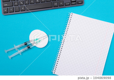 Vaccination or Revaccination Concept - Three Insulin Syringe on Blue Table Vaccination or Revaccination Concept - Three Insulin Syringe on Blue Table 104869098