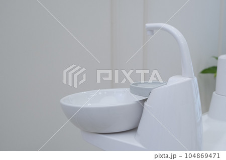 Dental cuspidor used for patients when they have to rinse their mouth Dental cuspidor used for patients when they have to rinse their mouth 104869471