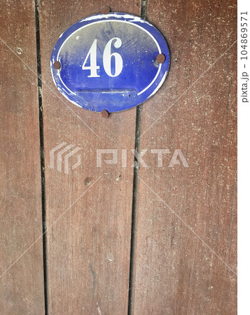 Close up of an house door number 46 104869571