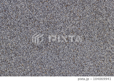 a close-up of a pile of poppy seeds used in cooking a close-up of a pile of poppy seeds used in cooking 104869941