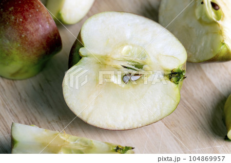 Sliced ripe apple of red color 104869957