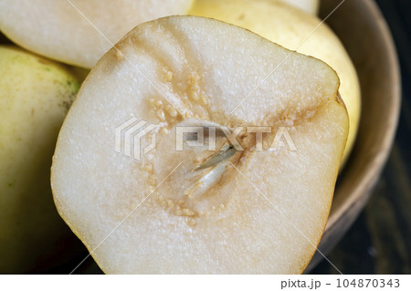 Sliced pear on the table 104870343