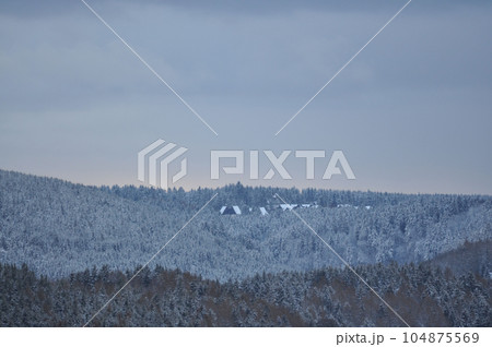 Beautiful shot of lonely cabins in the snowy Harz forest in Goslar, Germany Beautiful shot of lonely cabins in the snowy Harz forest in Goslar, Germany 104875569