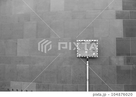 Street mirror in front of brick wall Street mirror in front of brick wall 104876020
