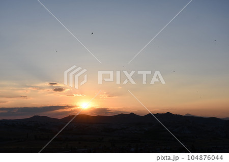 Glowing sunset in Cappadocia near Goereme in Turkey Glowing sunset in Cappadocia near Goereme in Turkey 104876044