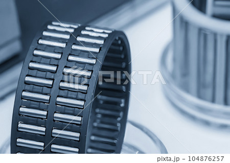 Close up scene the needle rolling bearing parts in light blue scene. 104876257