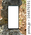 Smartphone in the nature. Mockup background. 104876591