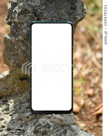 Smartphone in the nature. Mockup background. 104876591