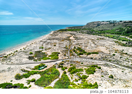 Drone point of view of sandy beach of Gran Alacant Drone point of view of sandy beach of Gran Alacant 104878113