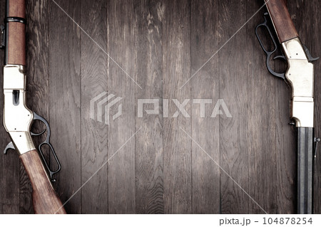 Old west guns. Lever action repeating rifles with ammunition 104878254