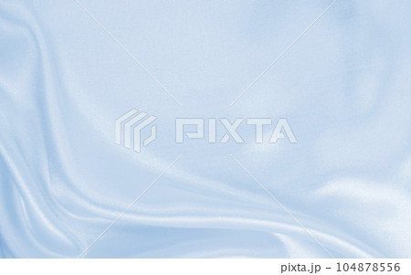 Smooth elegant blue silk or satin luxury cloth texture as abstract background. Luxurious background design 104878556