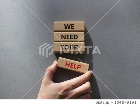 We need your help symbol. Wooden blocks with words We need your help. Beautiful grey background. Businessman hand. Business and We need your help concept. Copy space. 104879191