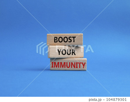 Boost your immunity symbol. Concept word Boost your immunity on wooden blocks. Beautiful blue background. Helthcare and Boost your immunity concept. Copy space Boost your immunity symbol. Concept word Boost your immunity on wooden blocks. Beautiful blue background. Helthcare and Boost your immunity concept. Copy space 104879301