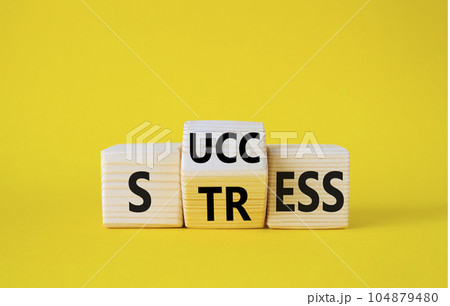 Success vs Stress symbol. Wooden cubes with words Stress and Success. Beautiful yellow background. Success vs Stress and business concept. Copy space 104879480