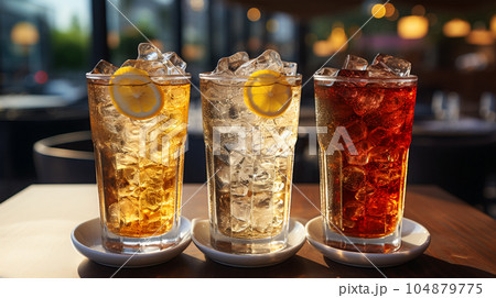 Tasty Cola in a glass with ice cubes and mint in a bar or cafe, menu concept Tasty Cola in a glass with ice cubes and mint in a bar or cafe, menu concept 104879775