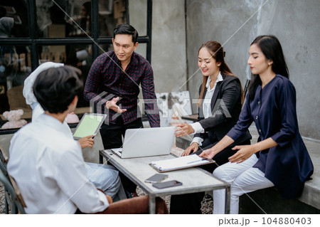 a young business man brainstorming, collaboration or cooperation a young business man brainstorming, collaboration or cooperation 104880403
