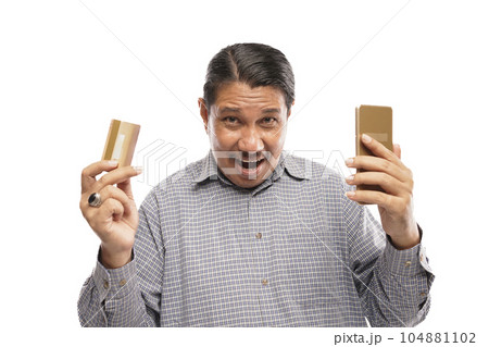old asian man standing while holding phone and card white background 104881102