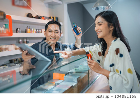 female customer pointing on the digital tablet female customer pointing on the digital tablet 104881168