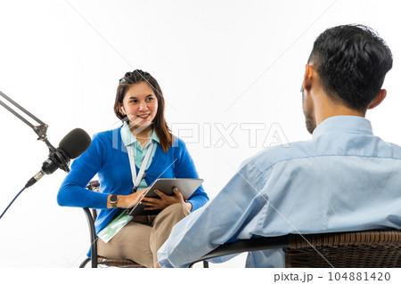 a beautiful journalist doing an interview with the adult man a beautiful journalist doing an interview with the adult man 104881420