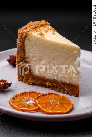 Delicious sweet cheesecake cake on textured concrete background Delicious sweet cheesecake cake on textured concrete background 104881622