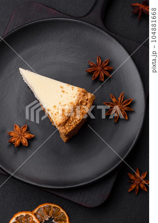 Delicious sweet cheesecake cake on textured concrete background 104881668