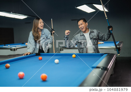 female player paying attention to the male player that clenched his arm 104881979