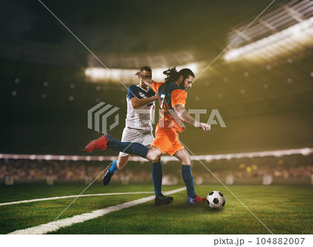 Football action scene with competing soccer players at the stadium 104882007