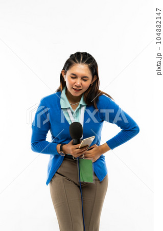 a reporter standing bent her body and toucing her stomach in pain a reporter standing bent her body and toucing her stomach in pain 104882147