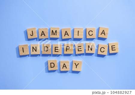 August 6, Jamaica Independence Day, flag of Jamaica, minimalistic banner with wooden letters 104882927