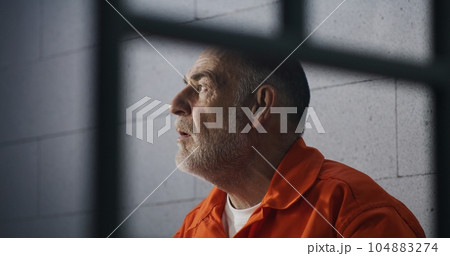 Criminal sits on bed and dreams about freedom 104883274